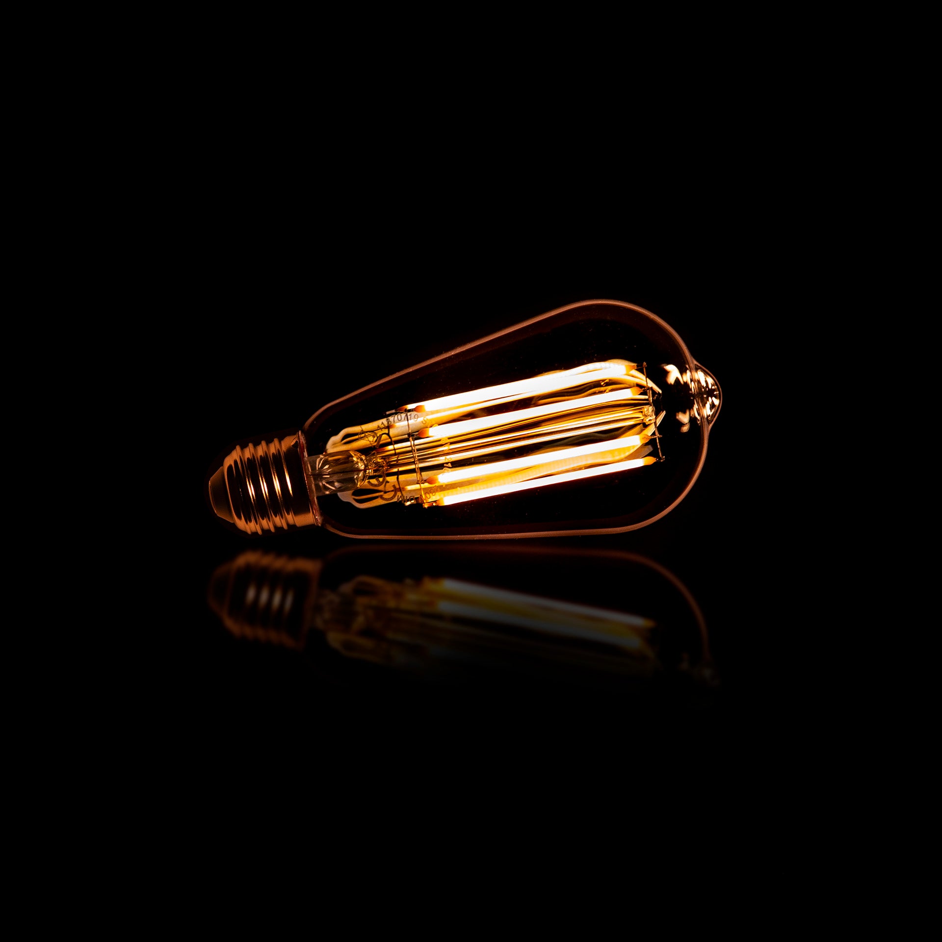 LED Filament ST64 Tröpfchen E27 Ø6,4x14 cm – dimmbar 6W, 2100K extra warmweiß, 450 lm, Amber-Glas (Vintage/Edison)